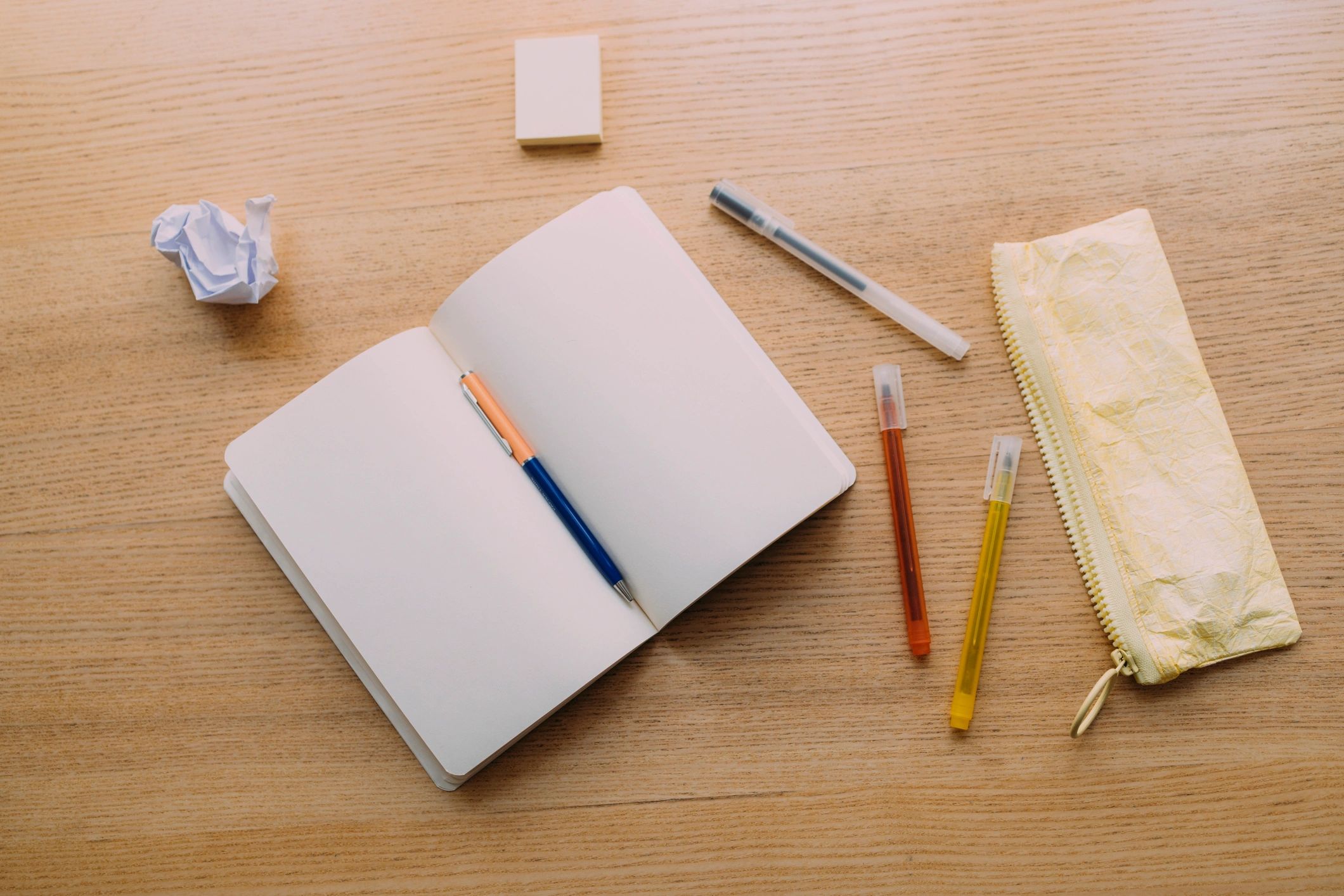 Open notebook and school supplies on a desk