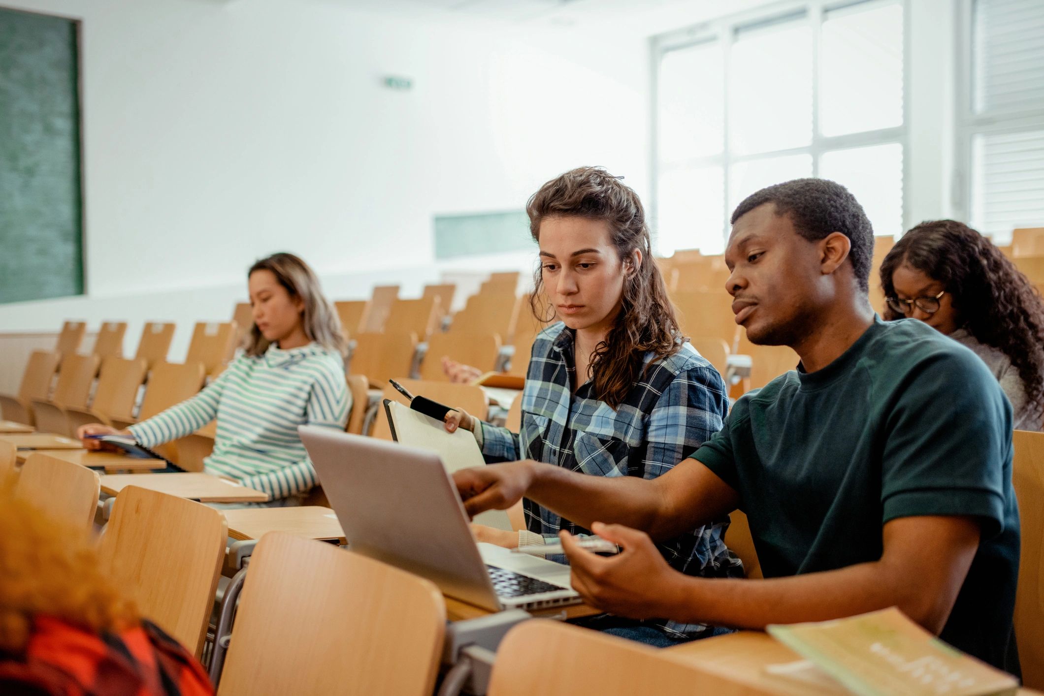 Students collaborating on a laptop during a study session